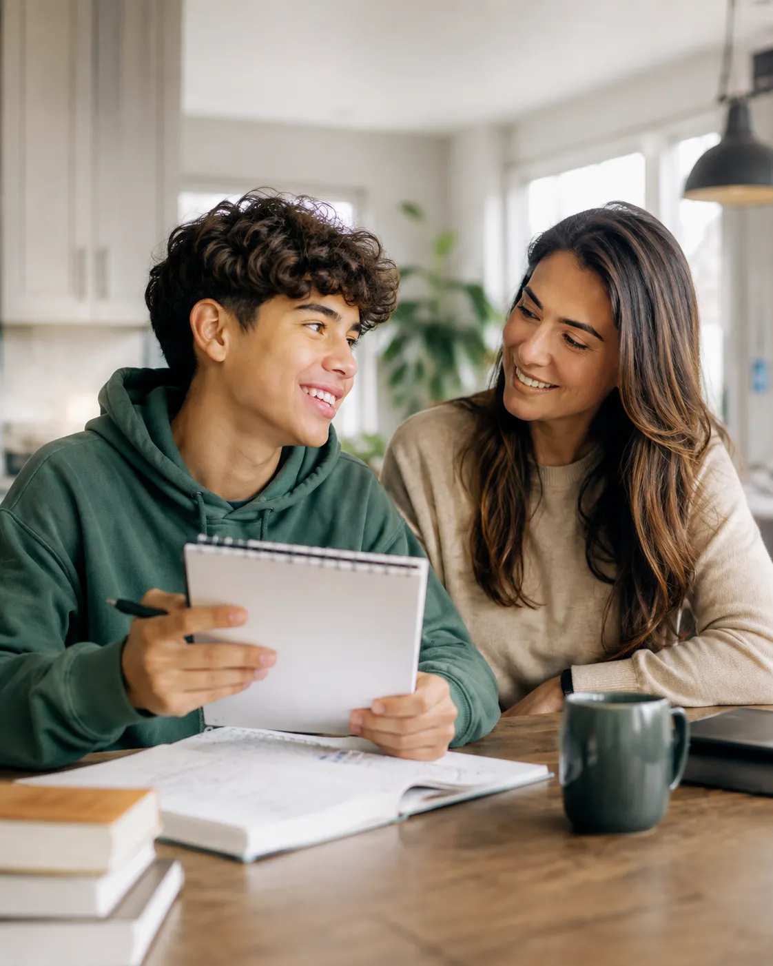 A parent encouraging a teen as they work together